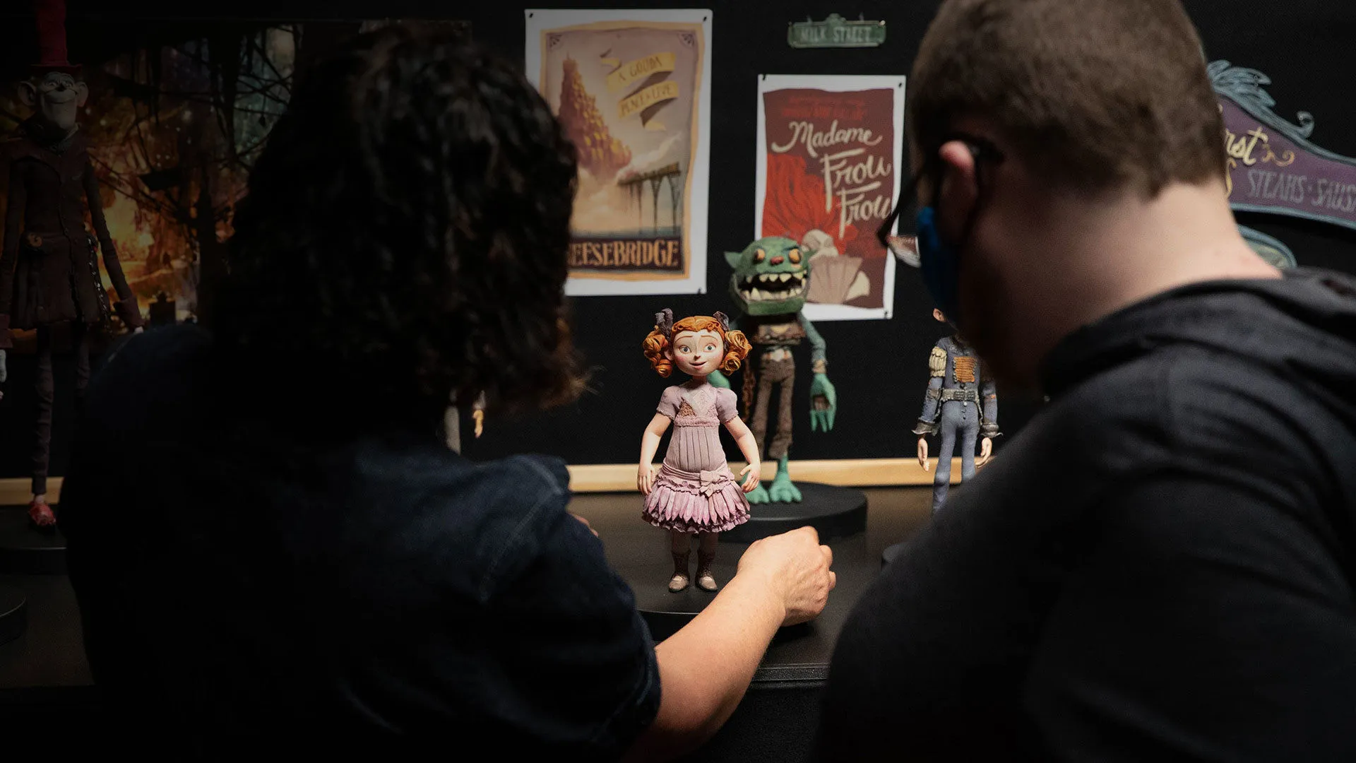 Two people looking at puppets from the film The Boxtrolls