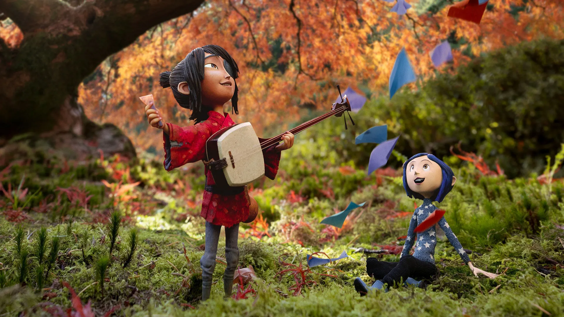 Kubo and Coraline puppets posed in the Portland Japanese Gardens