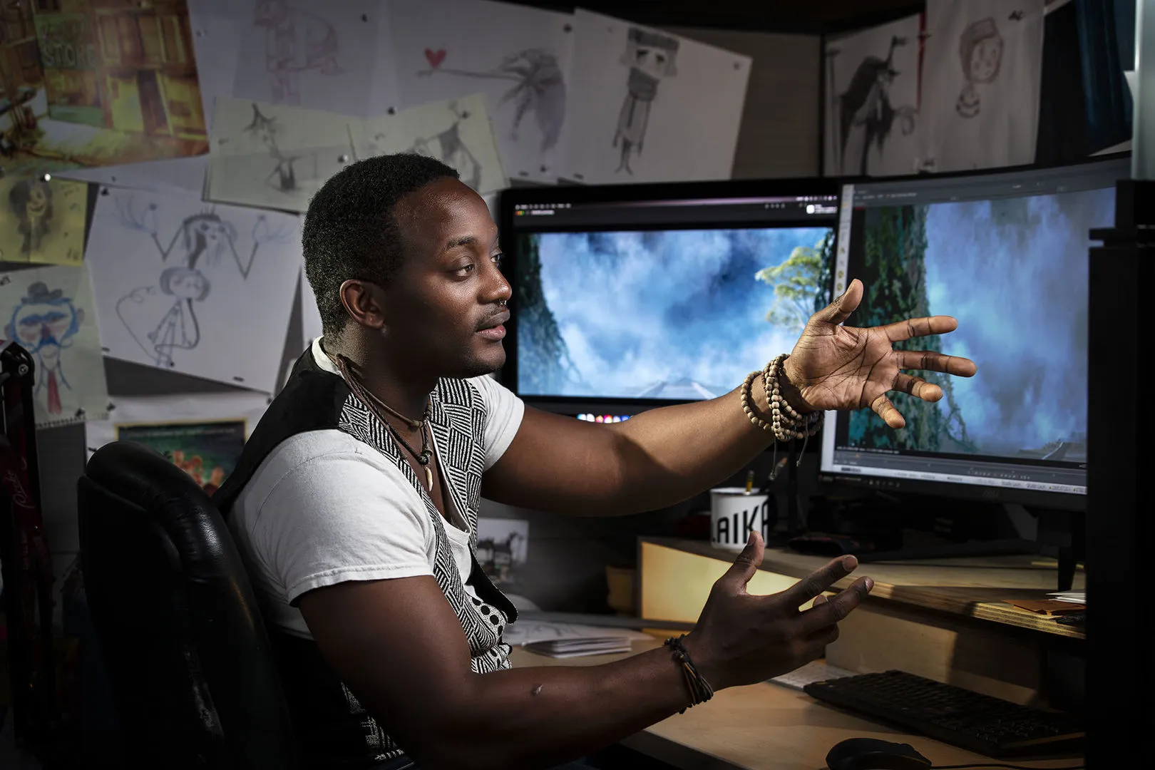 A man presenting some work on his computer.