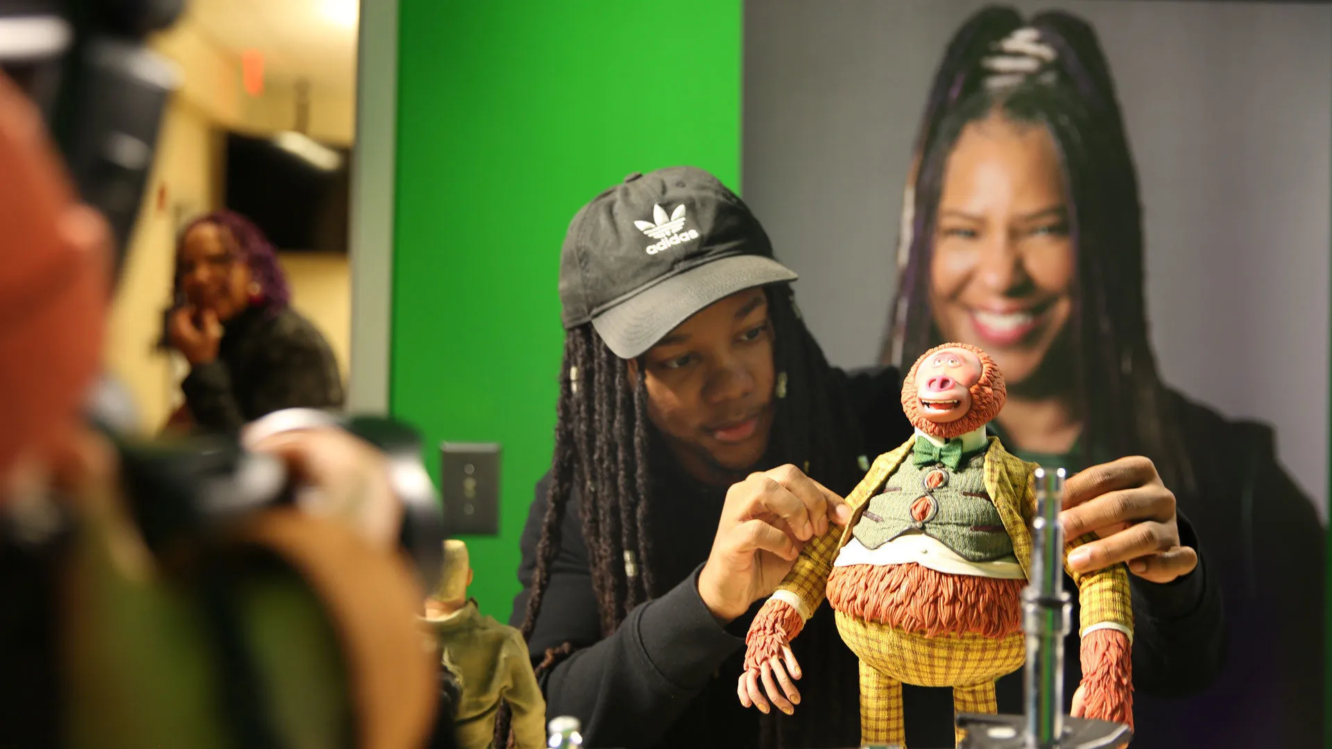 A college student interacting with a puppet from Missing Link