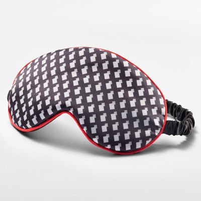 Sleep mask featuring a pattern inspired by Other Mother's black and white dress