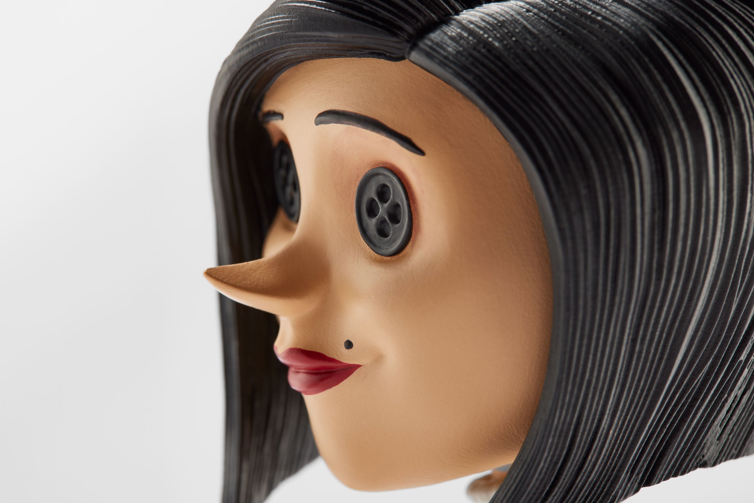 Close-up of the Other Mother Bobblehead's face