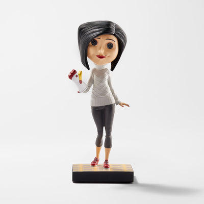 Other Mother Bobblehead wearing a chicken oven mitt and standing on a kitchen tile-style base