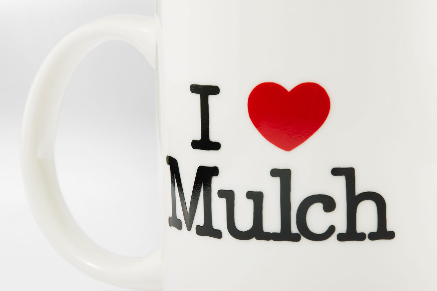 Close-up of the 'I Heart Mulch' Mug, showing the text and the handle