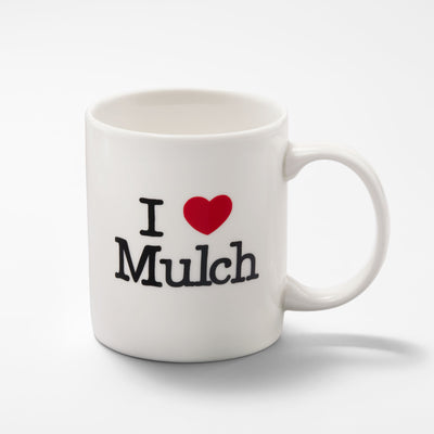 Full view of the ceramic mug that reads “I Heart Mulch”